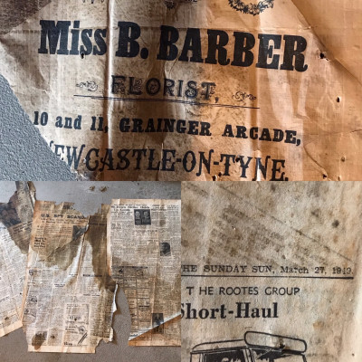 old newspapers under the carpet
